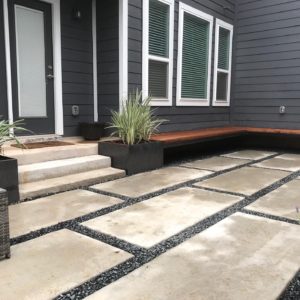 Cedar bench floating over large concrete pavers. – Craftedoutdoorliving.com