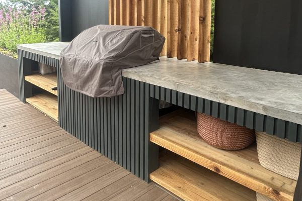 Outdoor kitchen with Open Shelving Landscape Design Austin TX