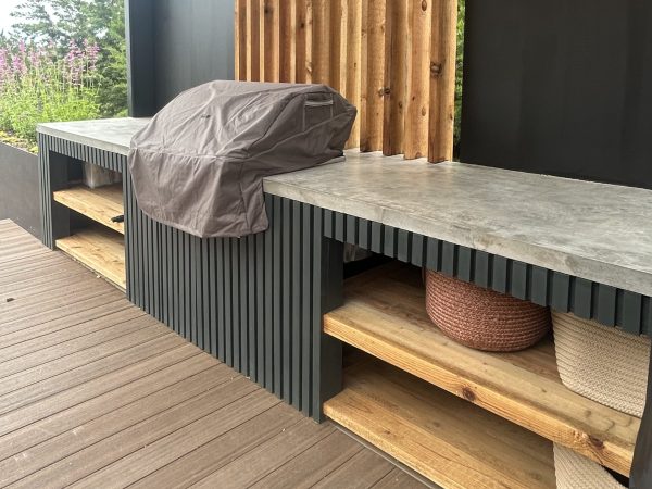 Outdoor kitchen with Open Shelving Landscape Design Austin TX